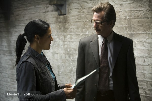 The Dark Knight - Publicity still of Gary Oldman & Monique Gabriela Curnen